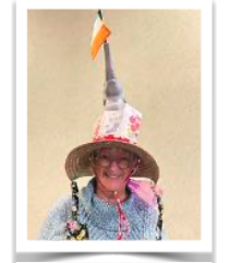 Janet modeling an example of a creative garden hat to kick off the new “Garden Hat Competition” for the May 6 Gate & Garden Tour.
