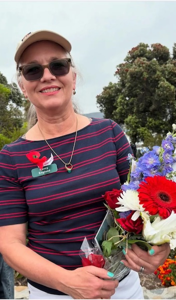 Nancy presenting memorial day flowers